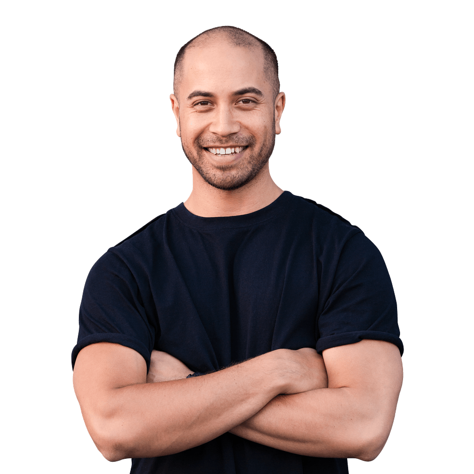 Man in a black t-shirt smiling with crossed arms