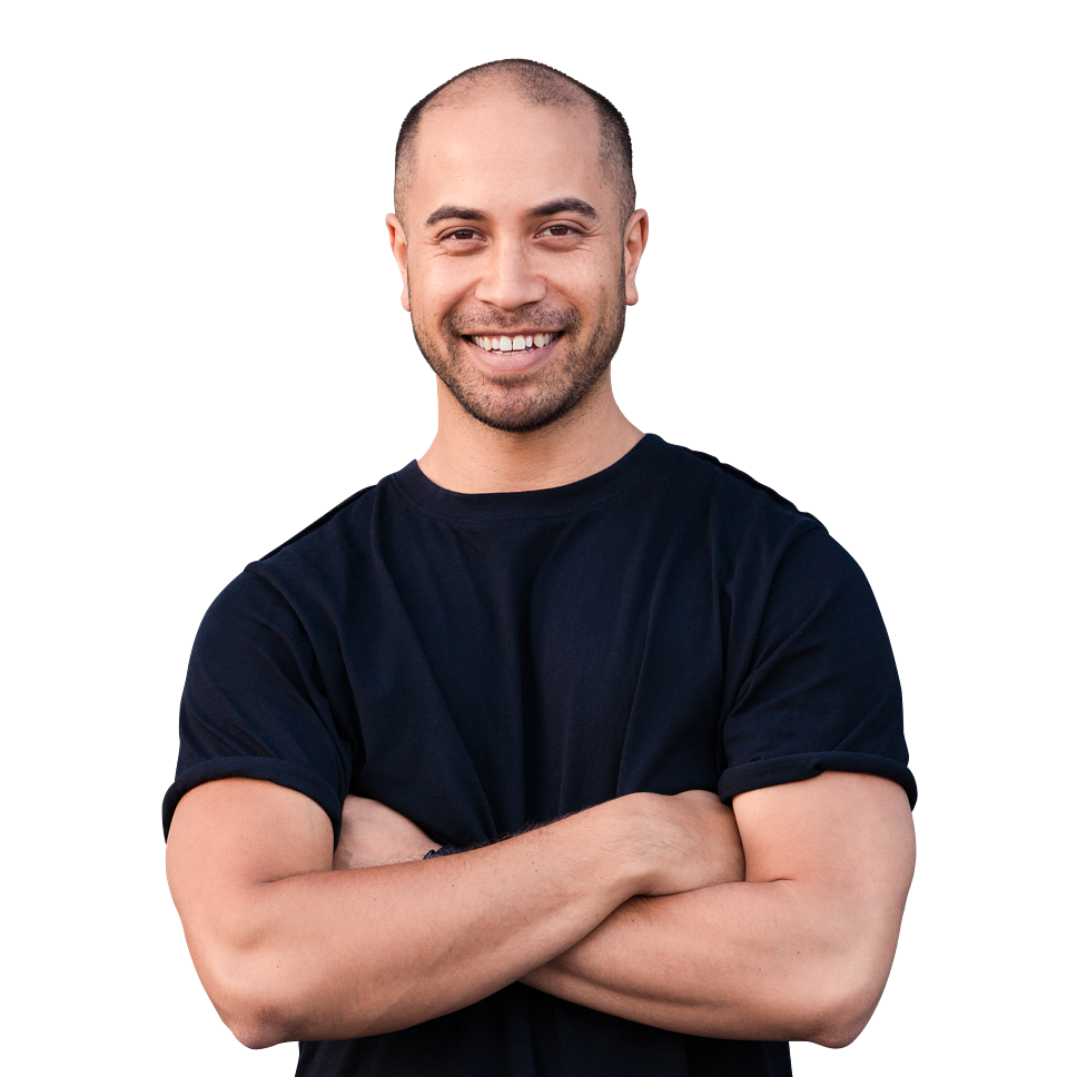 Man in a black t-shirt smiling with crossed arms